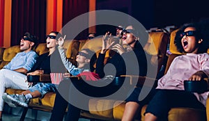 Group of people watch 3d movie in cinema theater