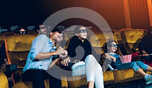 Group of people watch 3d movie in cinema theater