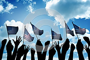 Group of people waving small USA flag