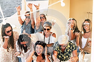 Group of people women friends have fun together celebrating with confetti and happiness - concept of friendship and event