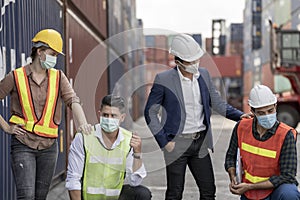 Group people worker is wearing protection mask face and safety helmet and wearing suit safety dress With background of container