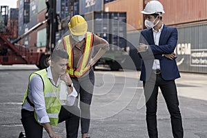 Group people worker is wearing protection mask face and safety helmet and wearing suit safety dress With background of container