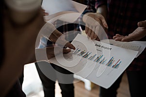 A group of people working man and woman in the plaid shirt Talking/consulting/idea about doing business. teamwork business meeting