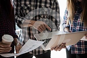 A group of people working man and woman in the plaid shirt Use y