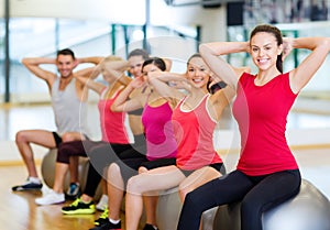 Group of people working out in pilates class