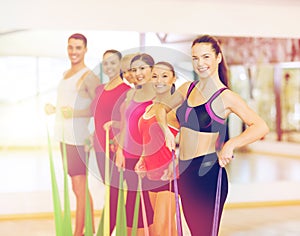 Group of people working out with rubber bands