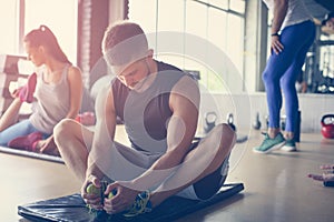 Group of people workout in healthy club.