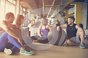 Group of people workout in healthy club.