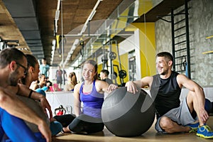 Group of people workout in healthy club.