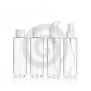 Group of PET cosmetic transparent bottles isolated on white background with disc top cap, flip cap, lotion pump and spray pump.