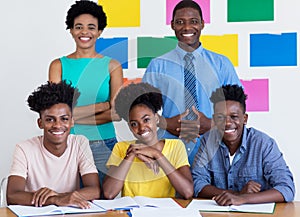 Group photo of african american students with male and female teacher
