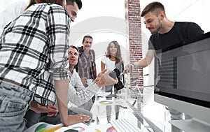 Group photo of editors working in a modern office.