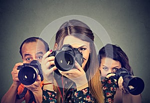 Group of photographers with professional cameras