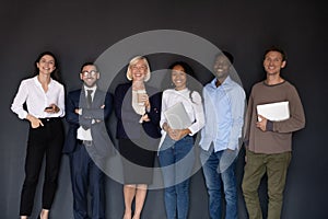 Group picture of multiethnic employees posing in office together