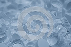 The group of plastic bottle caps in the light blue scene