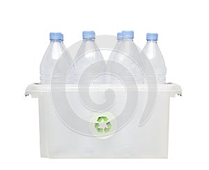 Group of plastic bottles in recycling bin over white background