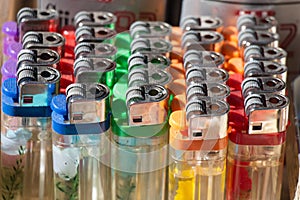 Group of plastic colorful lighters on display