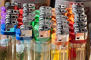 Group of plastic colorful lighters on display