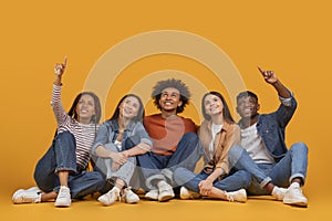 Group pointing up in unity on yellow background