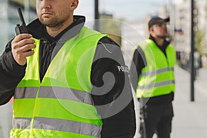 Group of police officers heading for intervention on the city streets