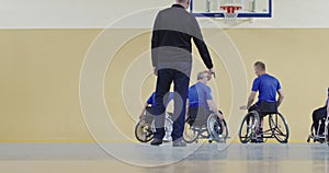 Group portrait of the basketball team with a trainer, slow motion video of basketball persons with disabilities with the