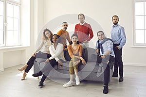 Group portrait of confident diverse business men and women in a new light office