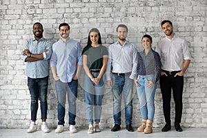 Group portrait of diverse millennial team of employees