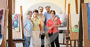 Group Portrait Of Elderly People Smiling At Art School