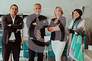 Group portrait of happy diverse colleagues of different ages. United businesspeople of 30s and 50s looking at camera