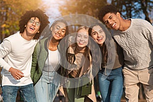 Group portrait of happy multiracial teenaged friends outdoors