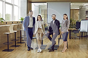 Group portrait of happy, smiling corporate business team in office conference room