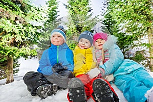 Group portrait of many kids together in snow