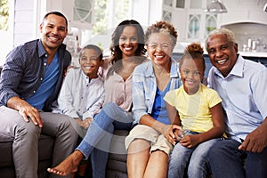 Group portrait of multi generation black family at home