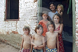 Group portrait of poor Paraguayan children in slum