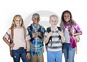 Group portrait of pre-adolescent school kids smiling on a white background photo