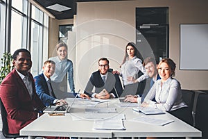 Group portrait of a professional business team looking confidently at camera
