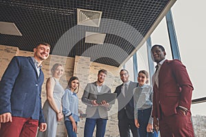 Group portrait of a professional business team looking confidently at camera