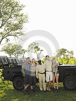 Group Portrait Of Tourists And Safari Guide