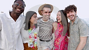 Group portrait of united multiracial best friends at the beach in summer