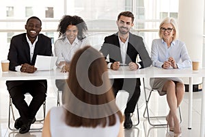 Group of positive diverse people interviewing vacancy applicant