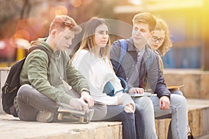 Group of positive teenagers having fun together