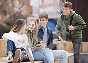 Group of positive teenagers having fun together