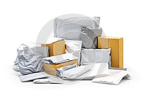 A Group of Postal Pack; plastic bag, paper envelope, brown paper box in studio light on the white background. Clipping Paths