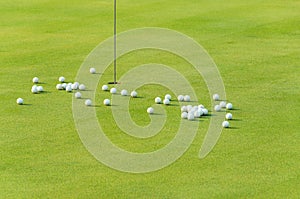 Group of practice golf ball on green