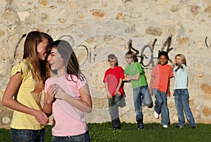 Group of pre teens whispering photo