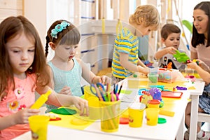 Group of preschool children engaged in handcrafts