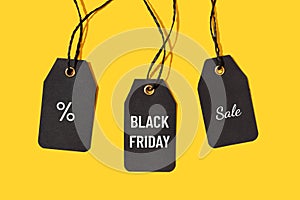 Price tags with Black friday sale text isolated on yellow background