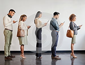 Group, professional and cellphone standing in a line at a job interview at an agency or workplace. Business, people and