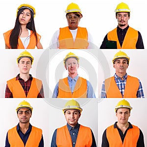 Group of professional construction workers against white studio background