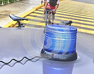 Group of professional cyclists training on highway with safety escort car. A group of cyclists followed by team cars